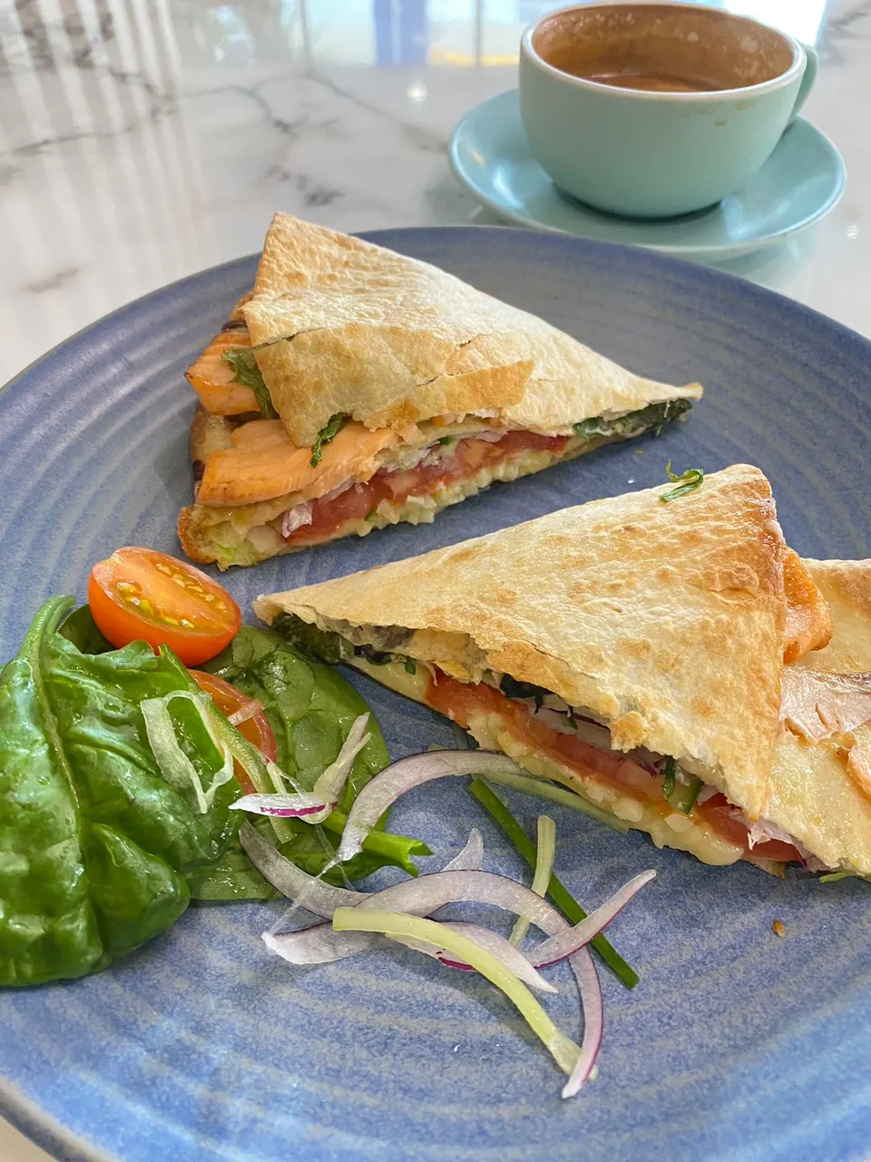 Grilled wrap with fresh salad and coffee